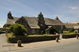 Medieval building with wavy roofline.